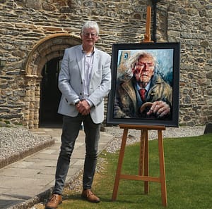 RS Thomas portrait outside St Hywen's Church, Aberdaron, Wales